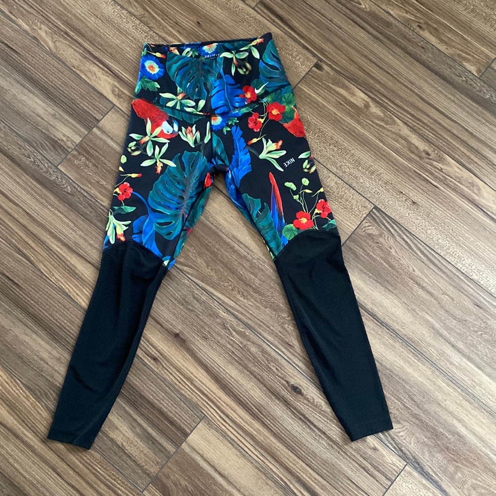 Nike size medium tropical print legging with mesh on bottom